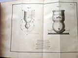 an open book with a drawing of a vase on it