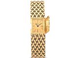 une photo d'une montre-bracelet pour femme en or, dotée d'un cadran serti de diamants
