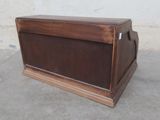 a wooden box that is sitting on the ground