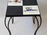 a small table with a black and white design on it