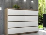 an image of a white and wood dresser in a living room