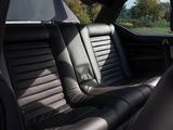 a black leather seat in the back of a car