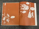 an open book with a picture of cartoon characters on it
