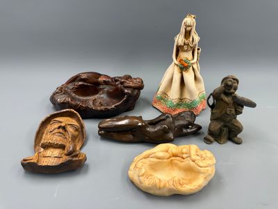 many different types of figurines displayed on the table