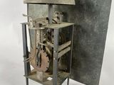 a clock that is sitting inside of a metal case
