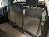 the back seats of a car with a seat belt in the back
