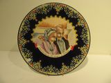 a plate with a picture of a man and a woman on it