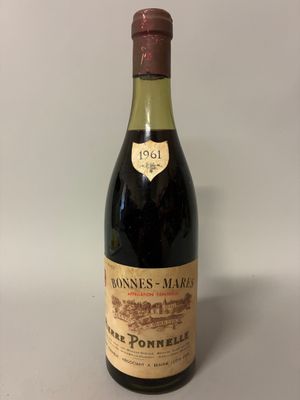 a bottle of wine sitting on top of a table