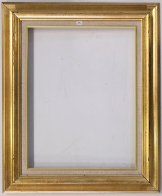 a gold frame on a white wall with a white background