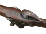 an old gun with a wooden handle on a white background