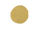 a close up of a gold coin on a white surface