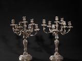 a pair of silver plated candelabs