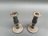 two candles that are sitting on a table