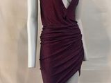 the mannequin is wearing a burgundy dress with a deep v neckline