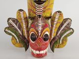an image of a colorful mask with feathers on it