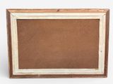 an old picture frame with a brown background and a white border