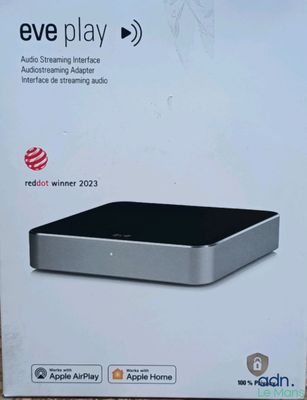 an apple tv box with the box open on a table