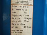 a sign on the side of a blue machine