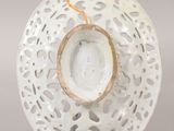 a white plate with a candle inside of it