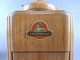 a close up of a wooden box with a logo on it
