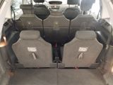 four seats in the back of a car that is empty