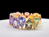 an image of a close up of a ring with different colored stones