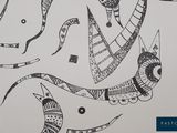 a black and white drawing of a snake on a wall