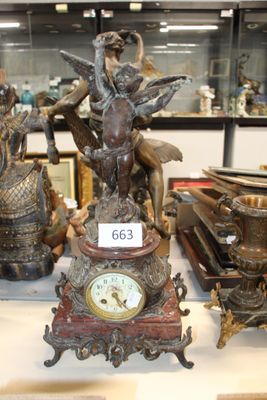 a lot of antique clocks on display in a glass case