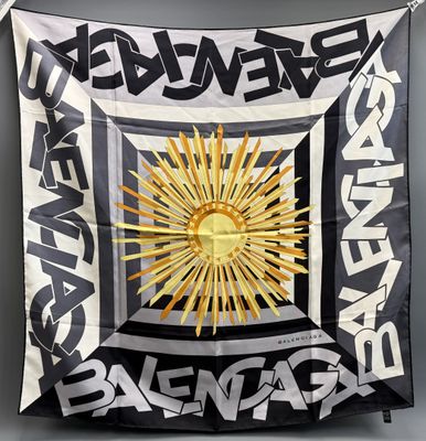 an image of a black and white banner with a sun on it
