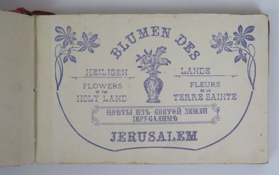 an old book with a picture of a vase of flowers