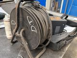 an image of a hose on a table in a garage