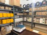 a room with a lot of boxes and a scale on the table