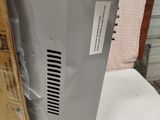 the back of a computer sitting on top of a white table