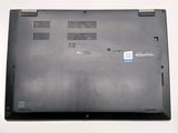a black laptop with a blue sticker on the back of it
