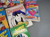 a lot of books that are on the table