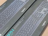 two boxes that have a keyboard on top of them