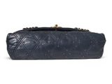 a close up of a blue purse on a white background