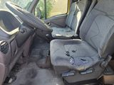 a seat in the back of a truck with a steering wheel