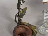 a glass candle holder with a bird on it and a glass candle holder with a bird on it