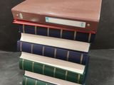 books stacked on top of each other on a table