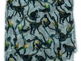 a close up of a scarf with monkeys on it