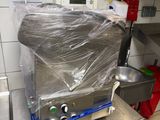 an image of a commercial kitchen with a toaster on a table