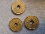 two chinese coins sitting next to each other on top of a table