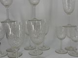 a lot of wine glasses that are sitting on a table