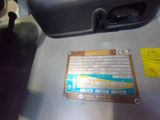a metal box with a sticker on it sitting on top of a table