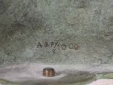 a close up of a bronze statue of a dog