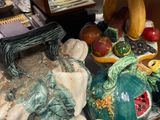 many different types of figurines displayed on the table