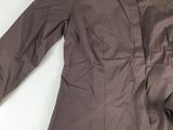 the jacket is brown and has a button down collar