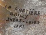 a close up of a piece of bread with writing on it