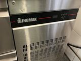 a stainless steel counter top oven in a commercial kitchen